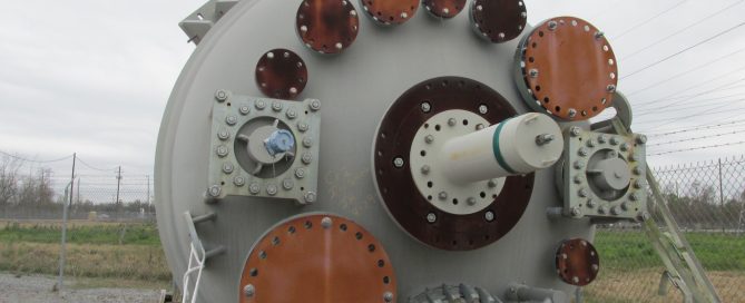 Used glass-lined reactor ready for corrosive chemical processing service.